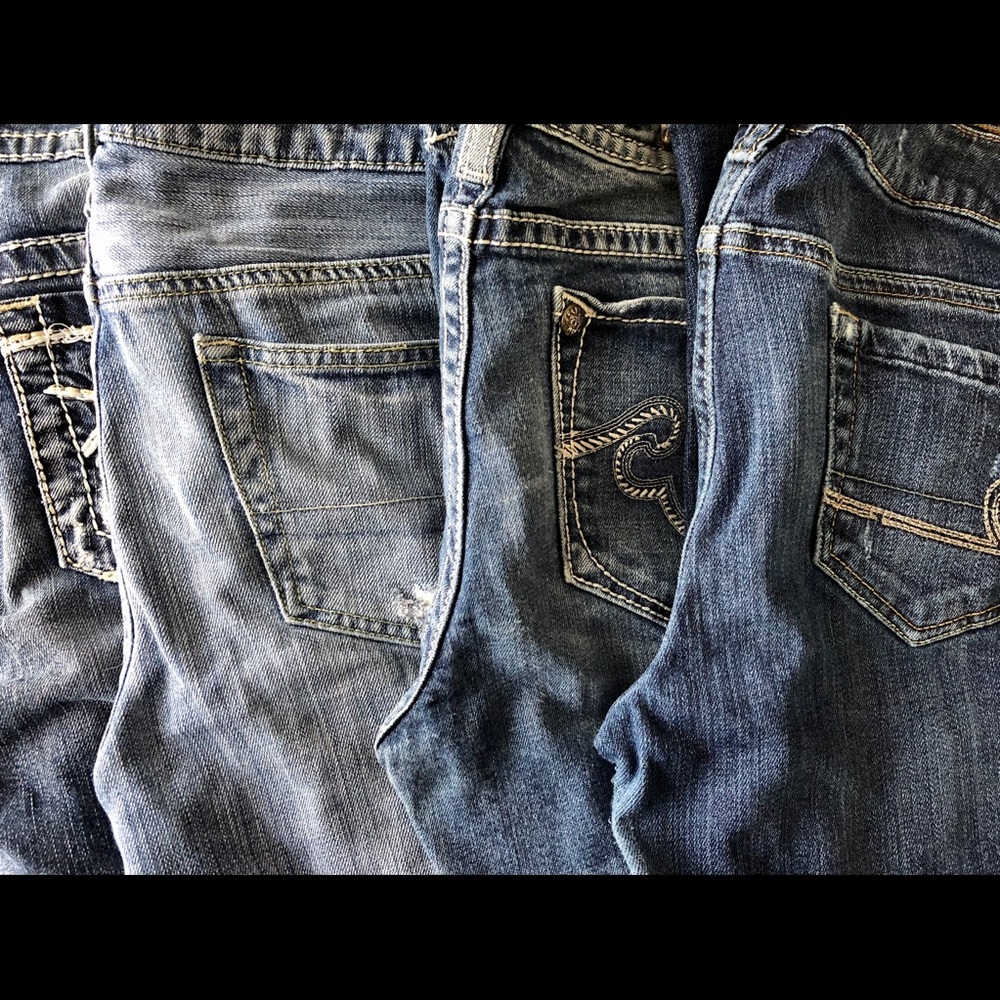 Lot of four pairs of jeans. A/E, Express, Silver.